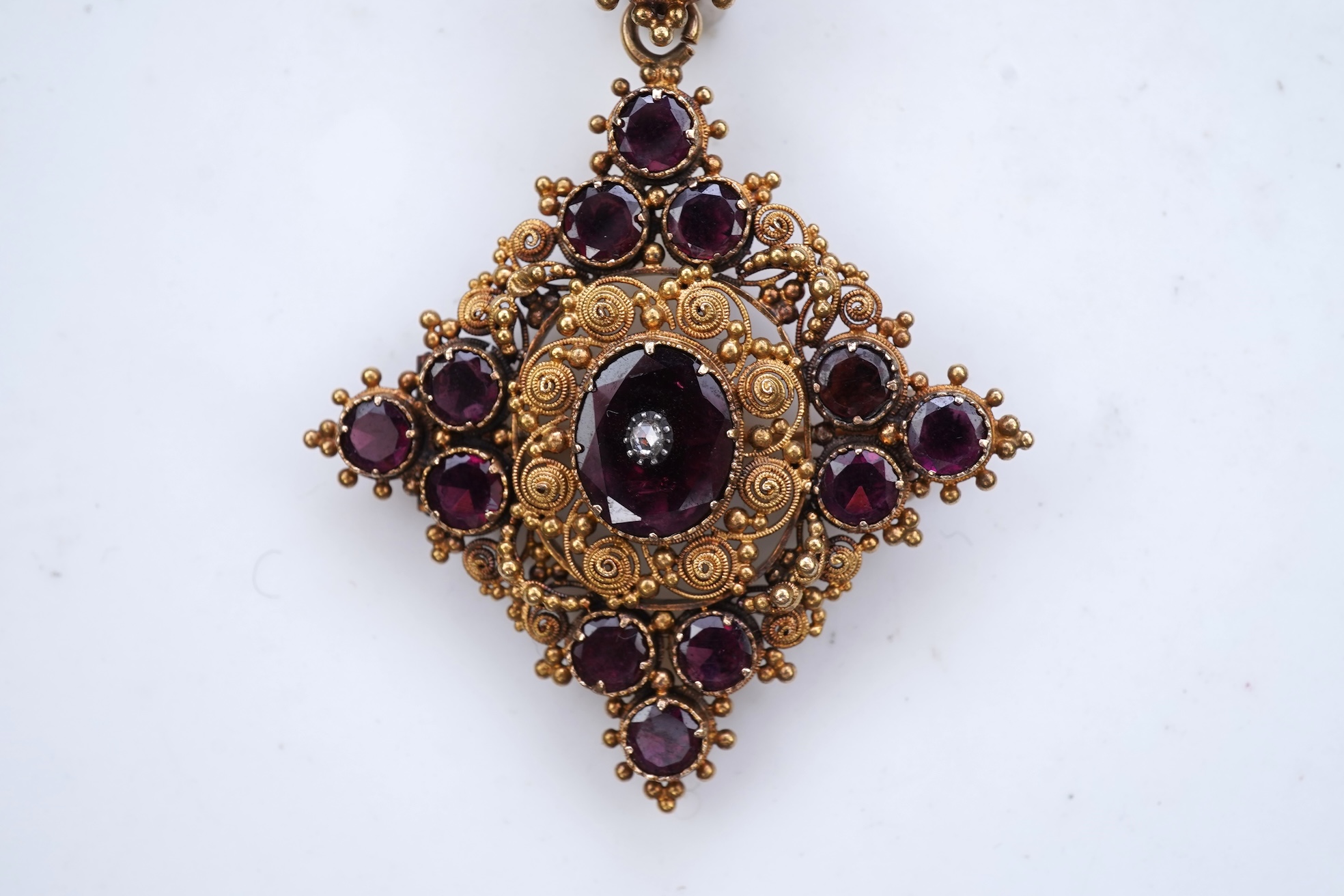A late Georgian garnet pendant/brooch, 1830s